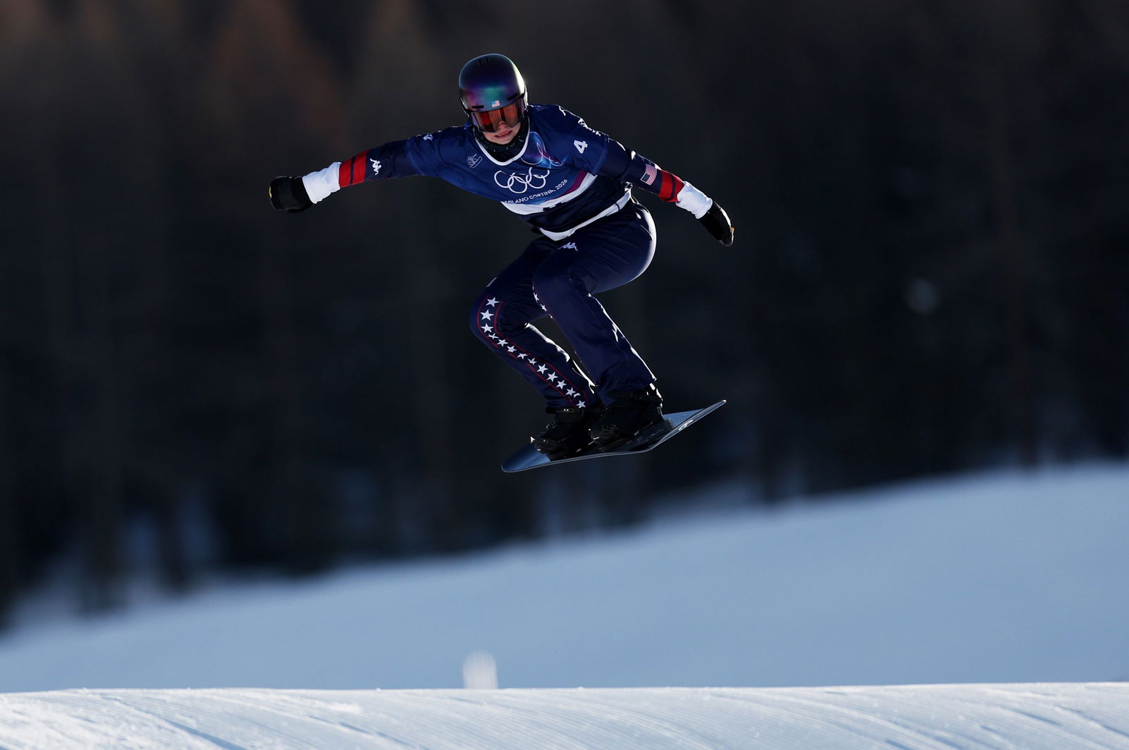 A competitor in the women's snowboard cross.