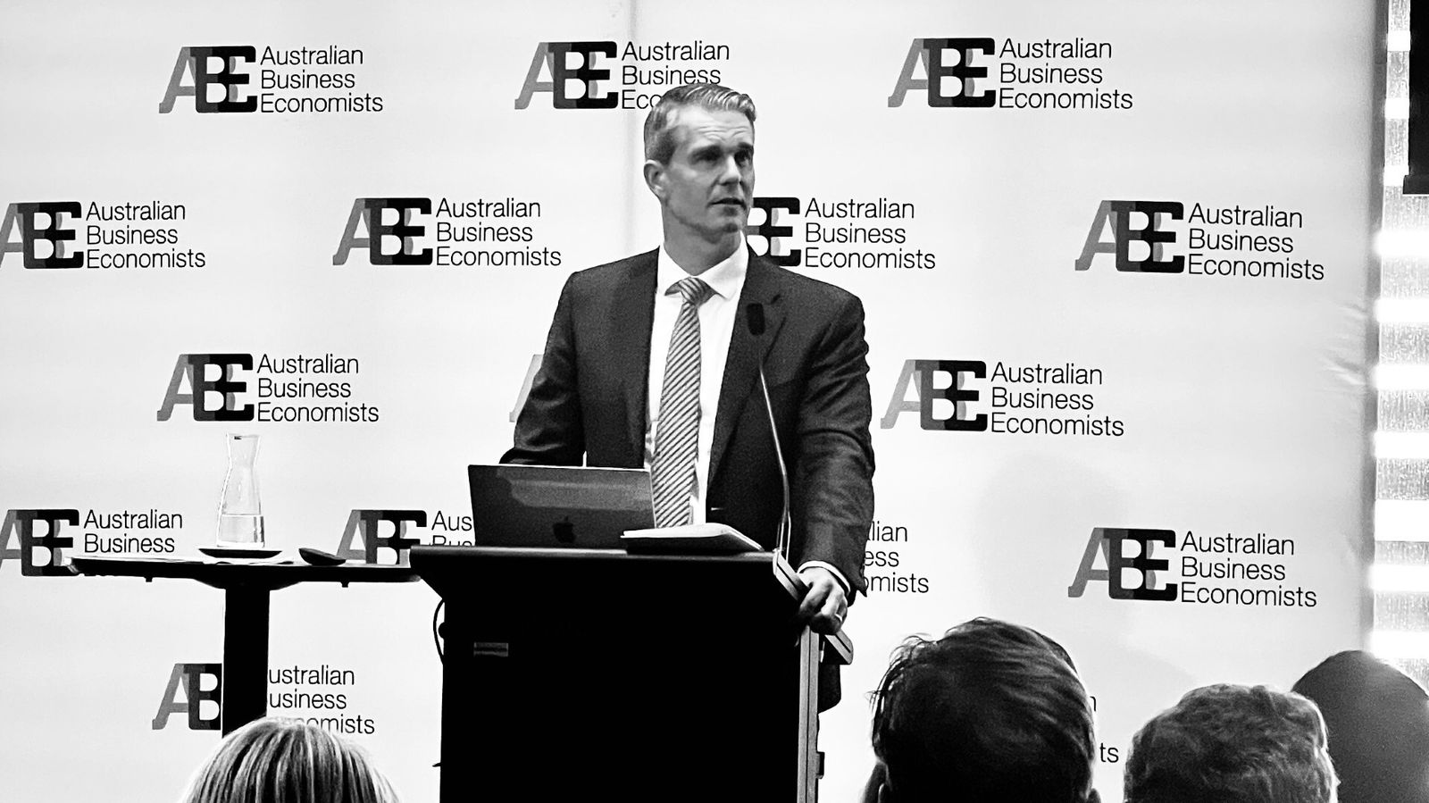 Man in suit at lecturn