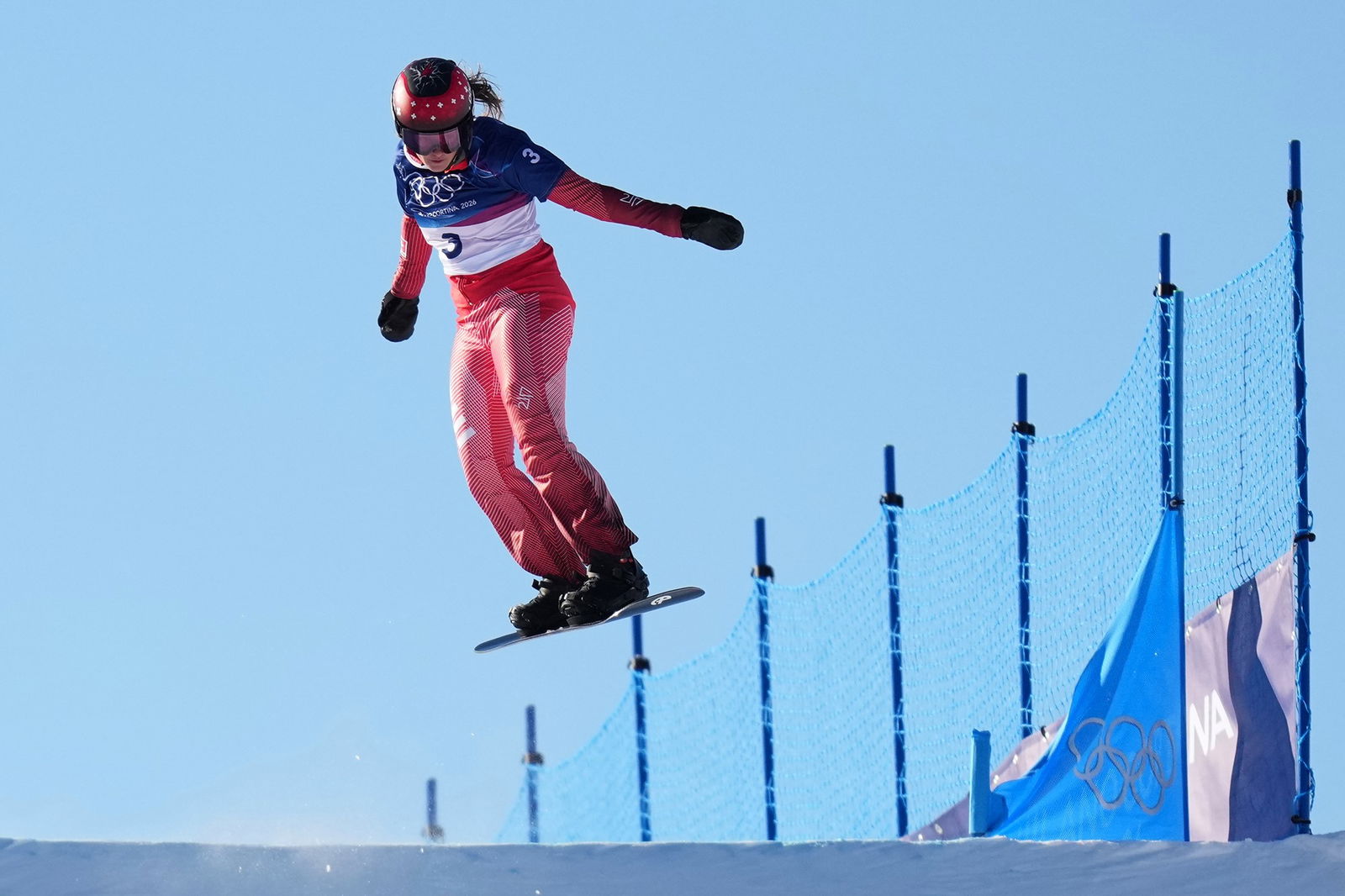 A competitor in the women's snowboard cross.