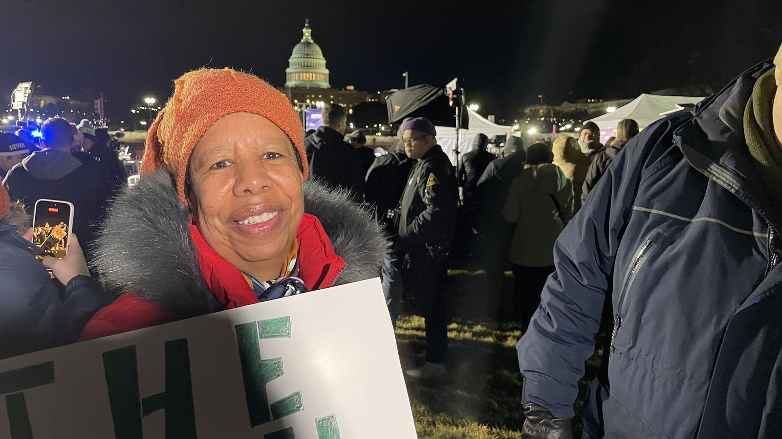a woman speaks to a camera on the mall in Washington DC
