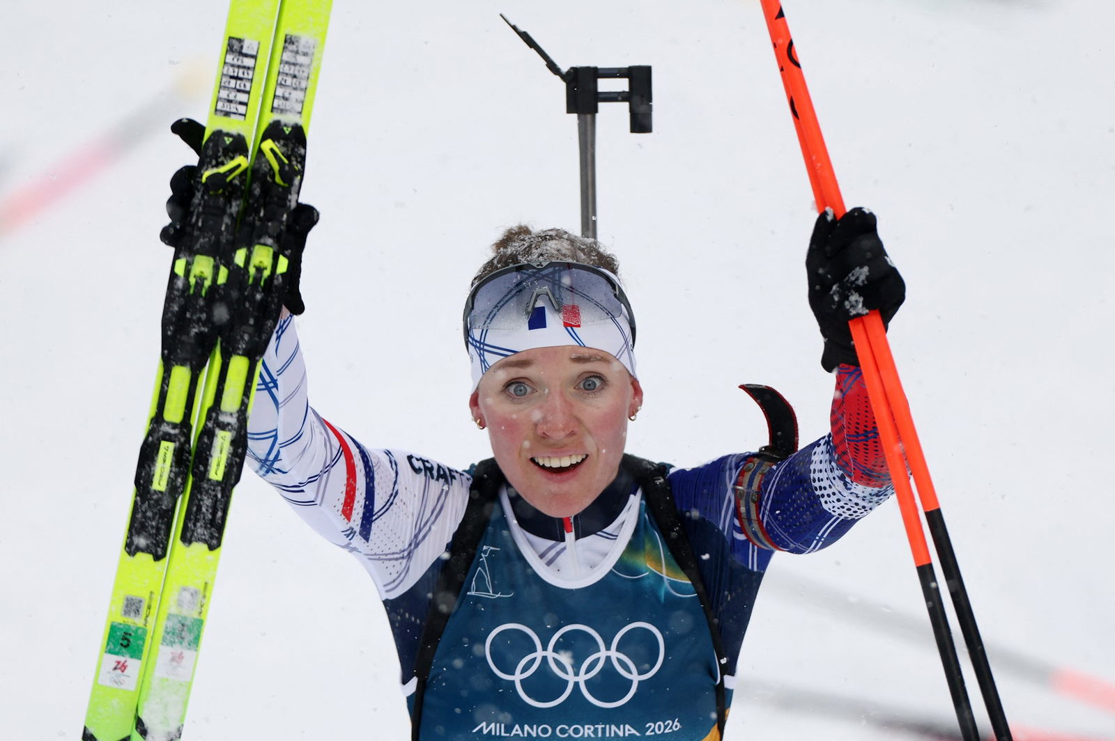Océane Michelon celebrates winning Olympic god.