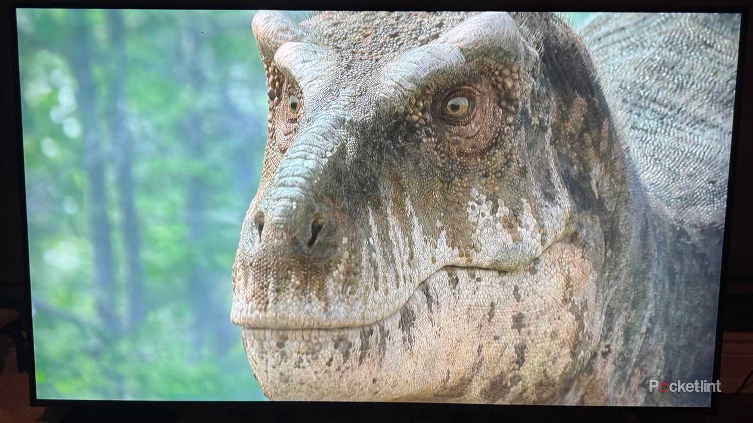 Dinosaur on Apple TV show displayed on LG QNED85 smart TV