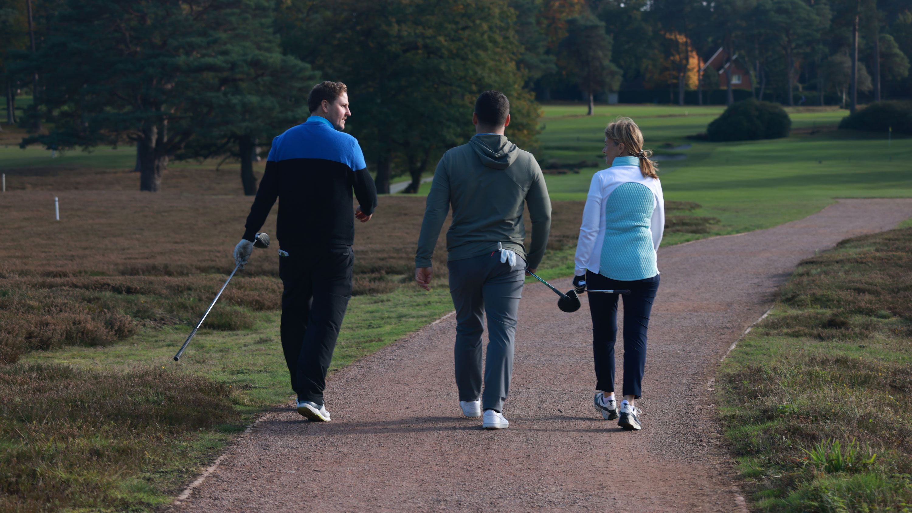 Golfers walking and laughing together
