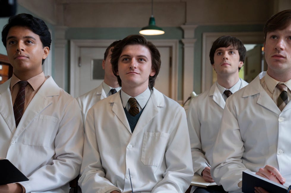 Max Macmillan as Timothy Turner in Call the Midwife max macmillan as timothy turner wearing his doctor's uniform and standing in a line with fellow trainees in call the midwife