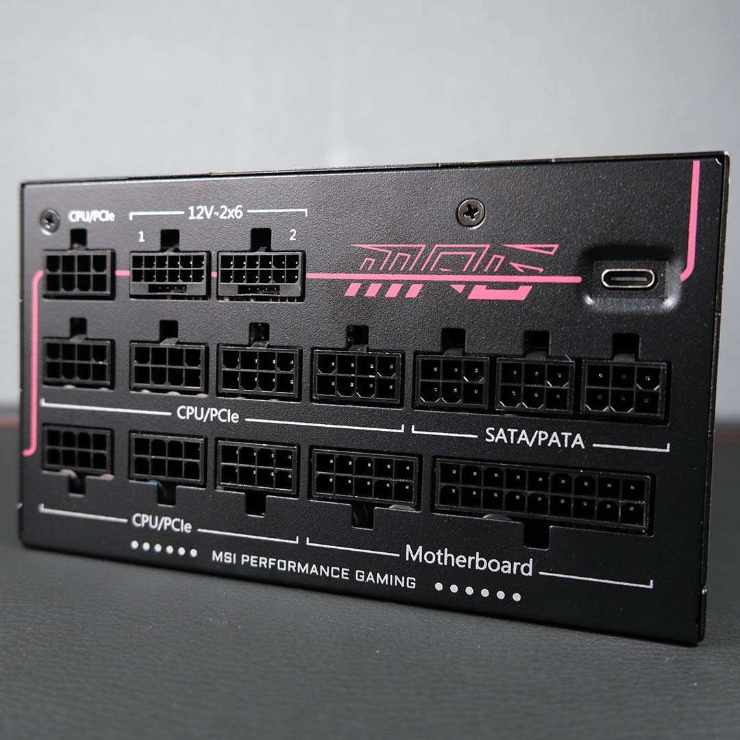 A close-up of the ports on the MPG Ai1600TS PCIE5 power supply.