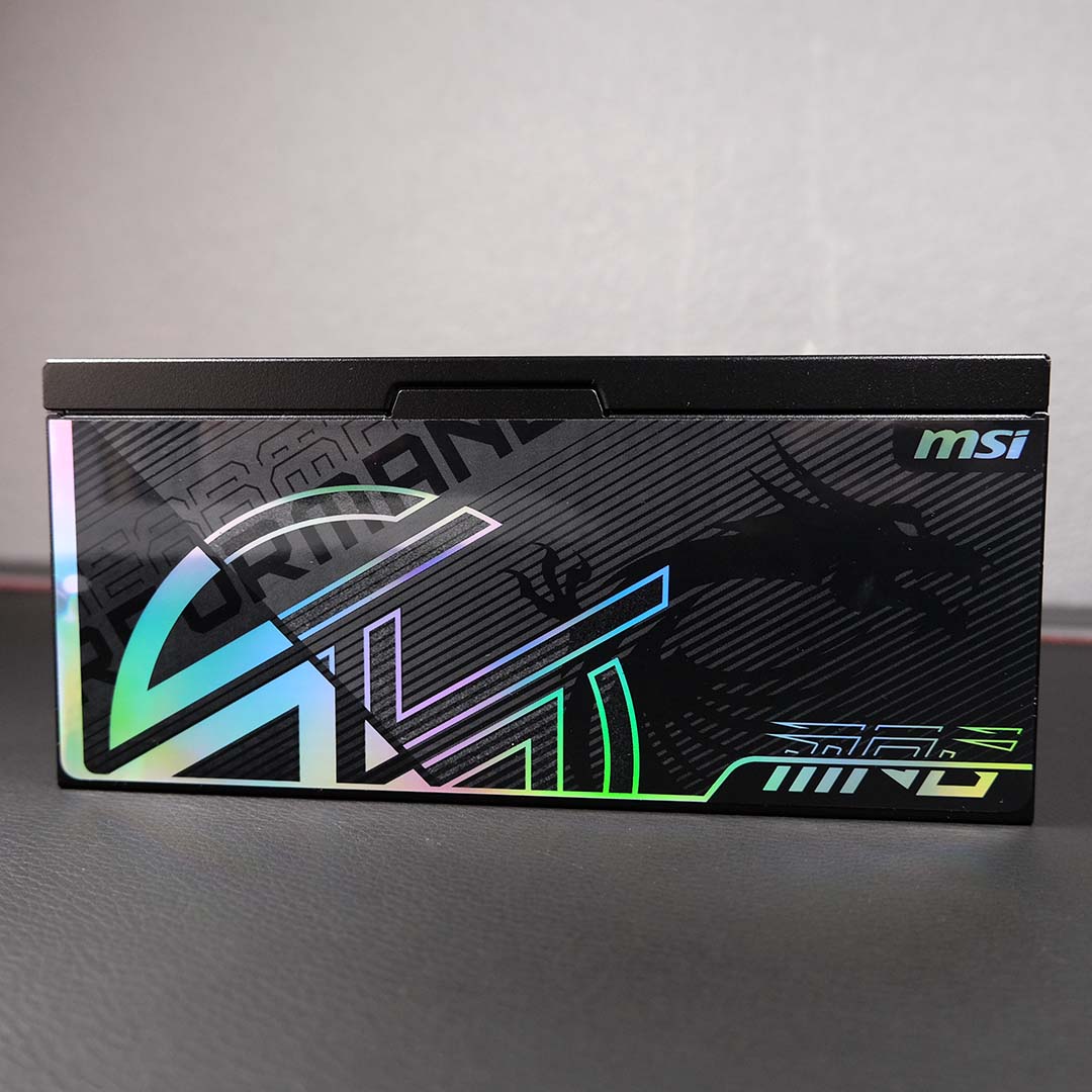 A close-up of the logos on the MPG Ai1600TS PCIE5 power supply.