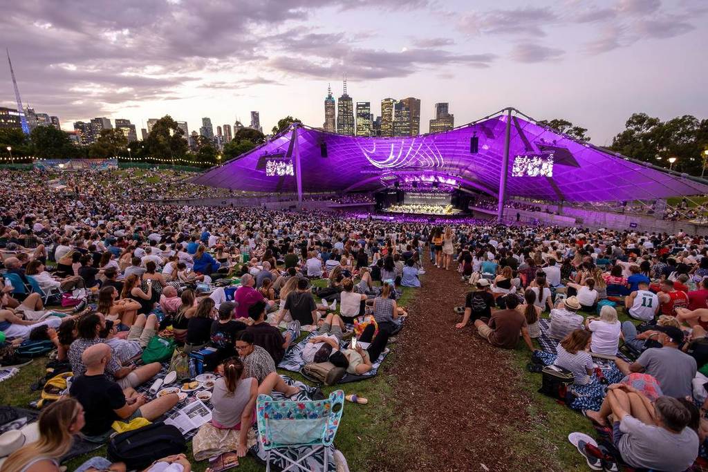 crowds at dusk watching the Melbourne Symphony Orchestra perform at Sidney Myer Music Bowl