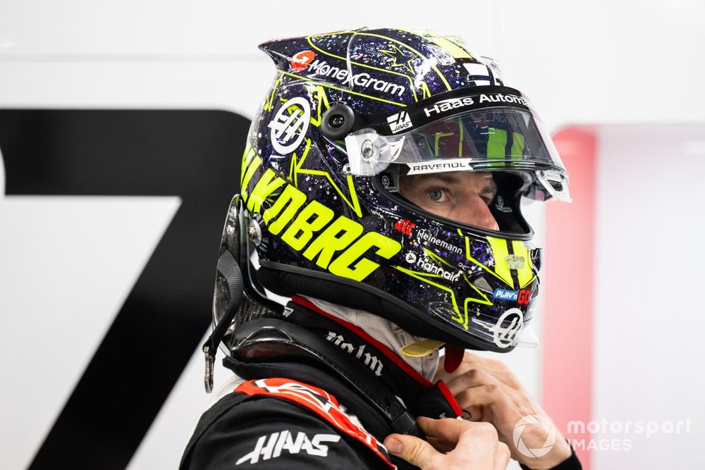 Nico Hülkenberg models the modern HANS device