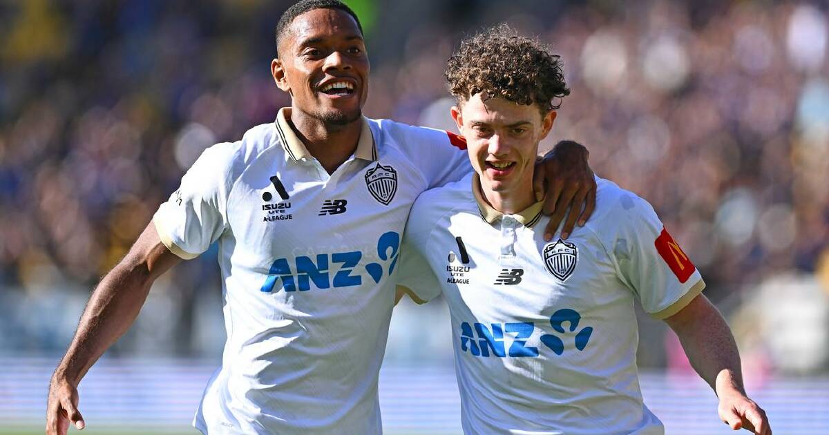 Jesse Randall (r) celebrates one of his two goals with Daniel Hall for Auckland against Wellington. (Kerry Marshall/AAP PHOTOS)