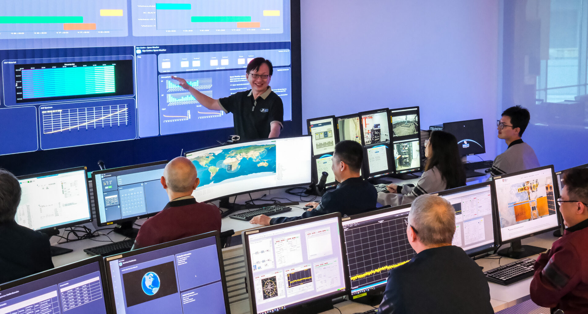 Exec Dir Lim Wee Seng briefing his team at the upgraded mission control at NTU