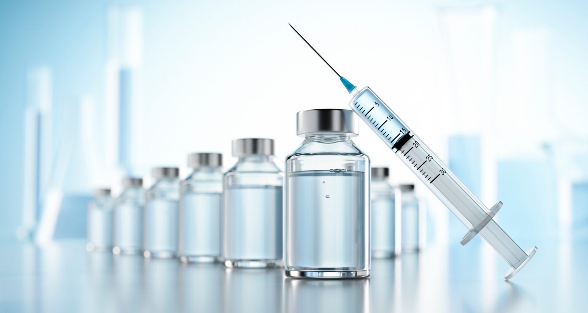 Vaccination,Concept,With,Syringe,And,Bottles,Of,Vial,With,Copy