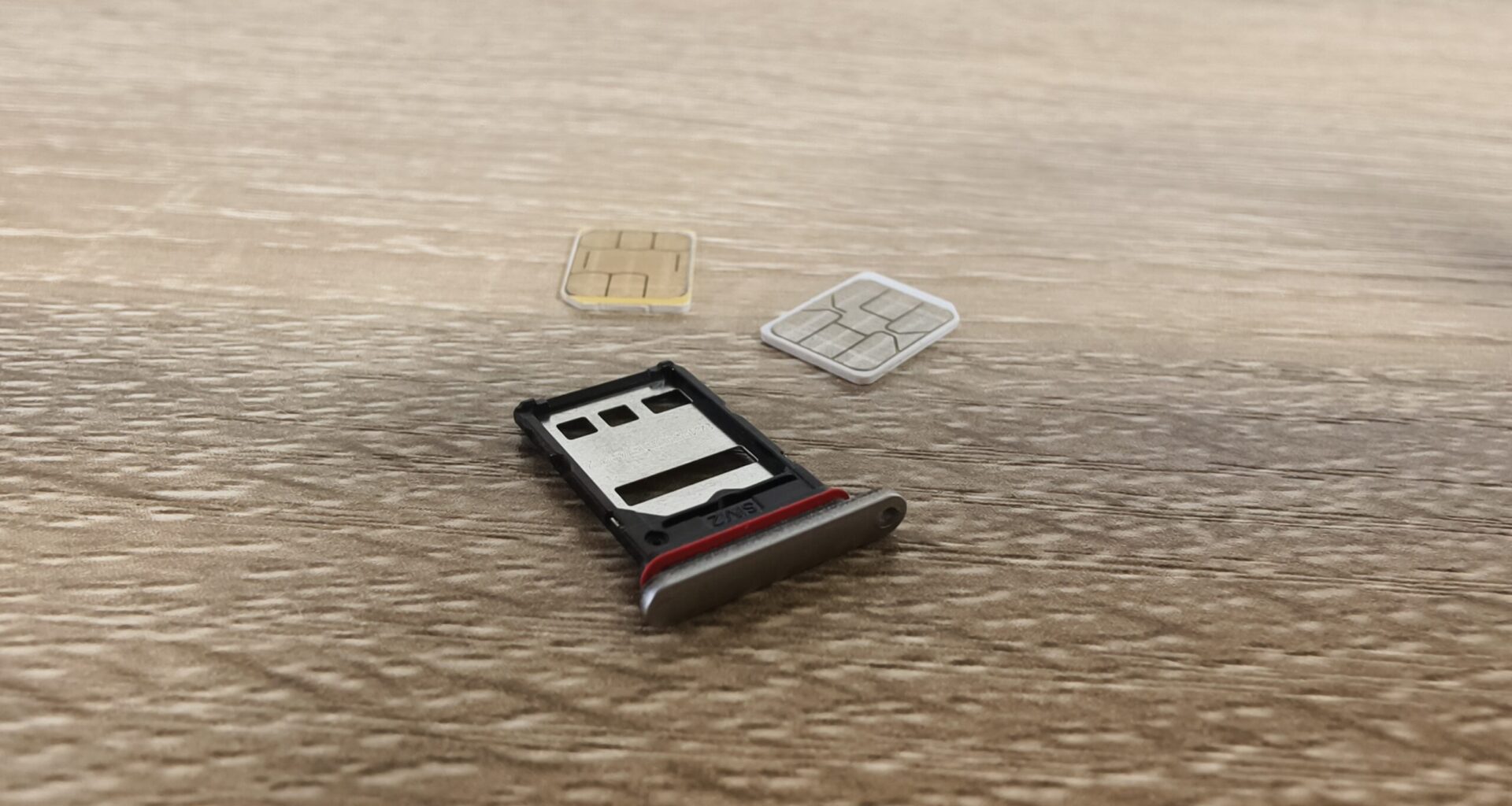 sim cards on a table with a sim tray