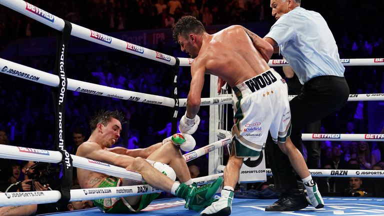 Michael Conlan falls out of the ring after being knocked out by Leigh Wood in their WBA Featherweight World Title contest