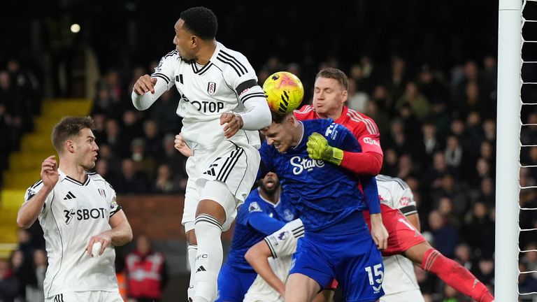 Bernd Leno punches the ball into his own net under pressure from Everton's Jake O'Brien