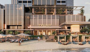 A rendered image of a building on the beachfront with "TRUMP" signed over the entrance.