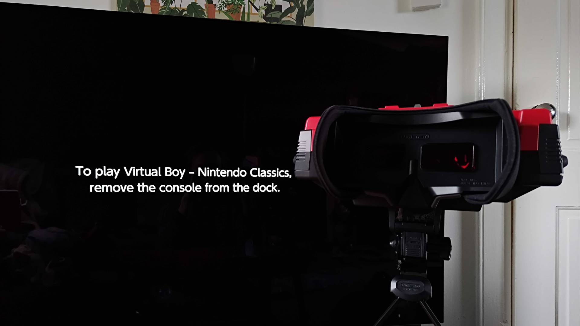 Virtual Boy with TV in backdrop displaying Switch 2 message that reads 