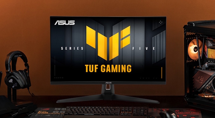 The TUF Gaming VG27AQM5A gaming monitor on a desk with other TUF Gaming gear