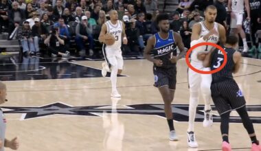 Victor Wembanyama getting hit by Desmond Bane during a Spurs-Magic game