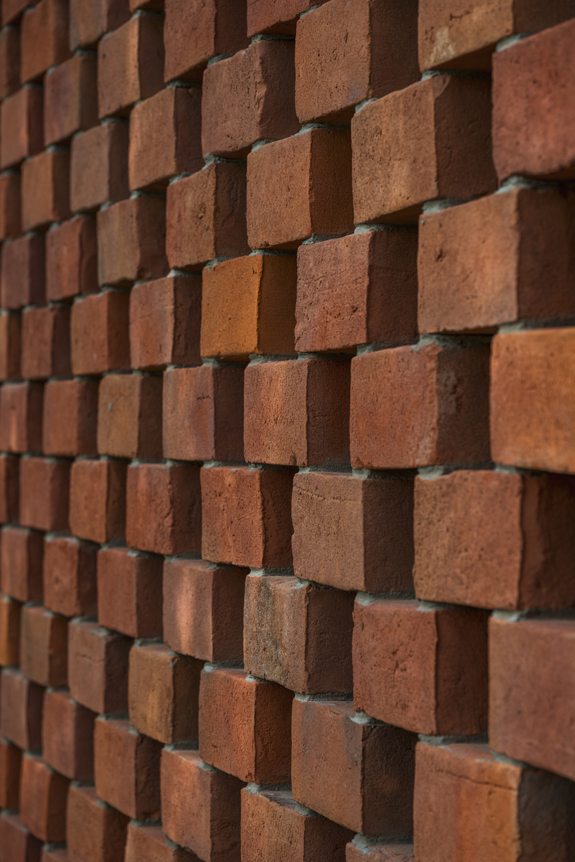 barrel-vaulted concrete cellar organizes vineyard building in poland