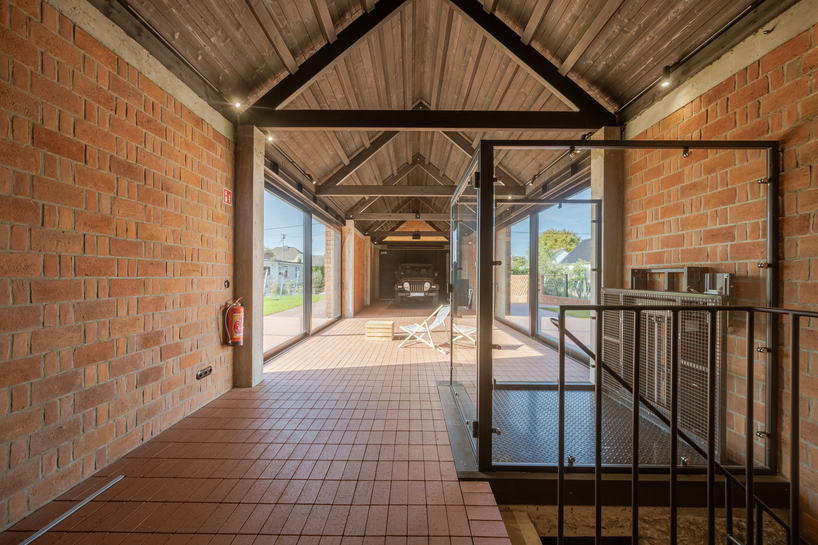 barrel-vaulted concrete cellar organizes vineyard building in poland