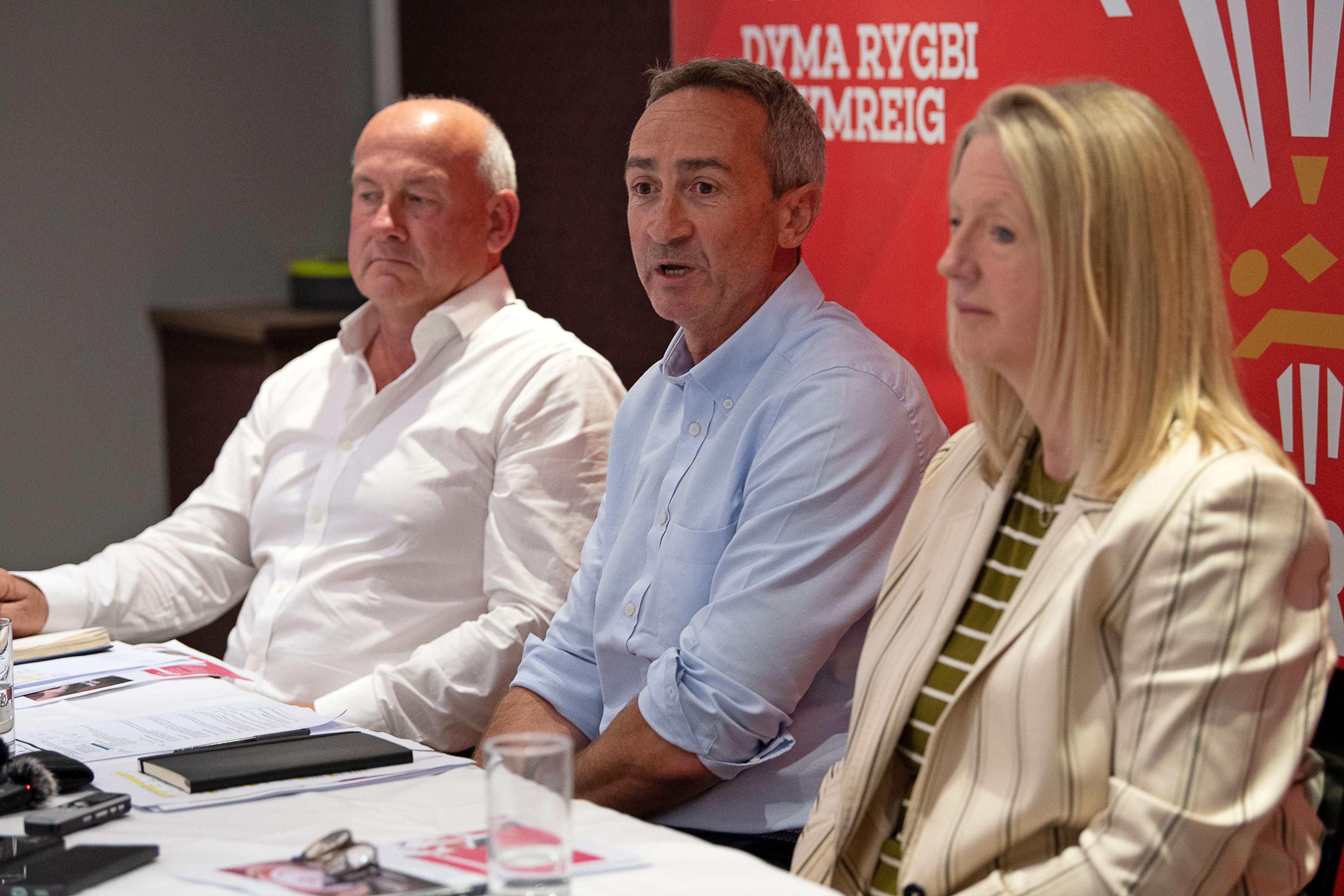 WRU Chairman Richard Collier-Keywood, Director of Rugby and Elite Performance Dave Reddin, and Chief Executive Abi Tierney at a press conference.