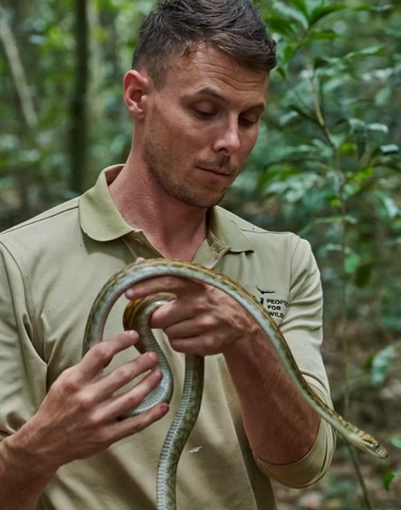 Daniel Natusch holding a snake.