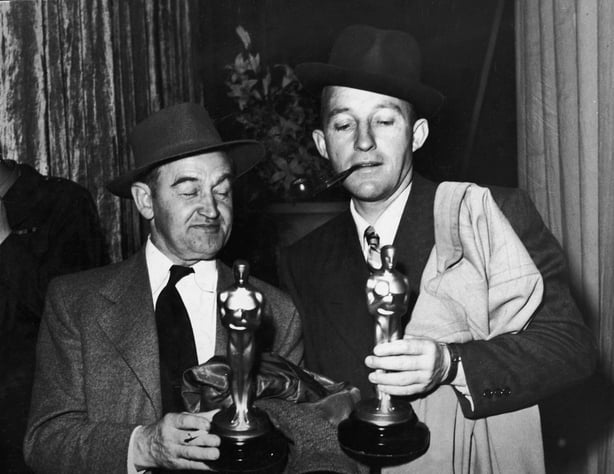 Irish-born actor Barry Fitzgerald (1888 - 1966) (left) holds his Oscar for Best Supporting Actor while American actor Bing Crosby (1904 - 1977) holds his Oscar for Best Actor, both for their roles in 'Going My Way,