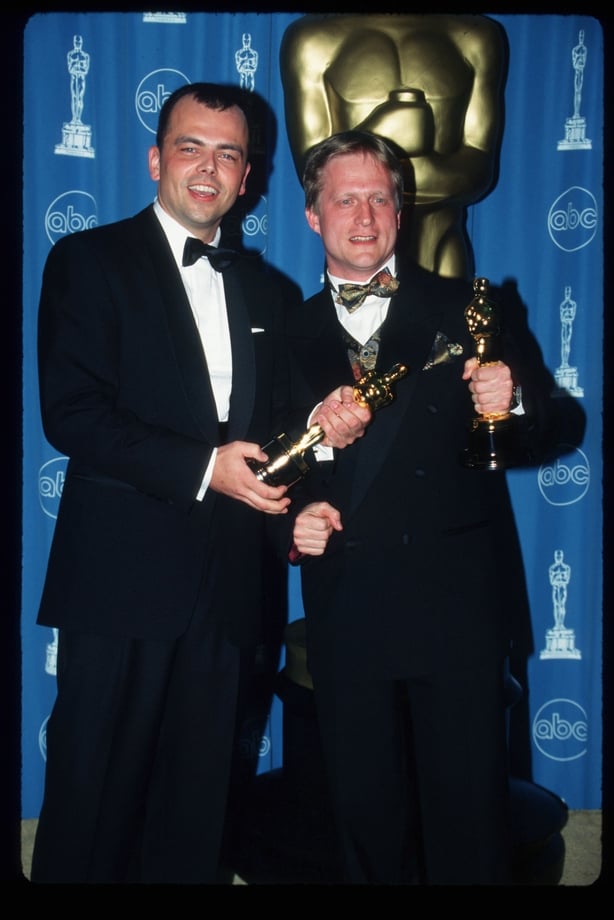 Filmmakers Tyron Montgomery (left) and Thomas Stellmach pose, holding Best Animated Short Oscar statuettes for their film 'Quest,'
