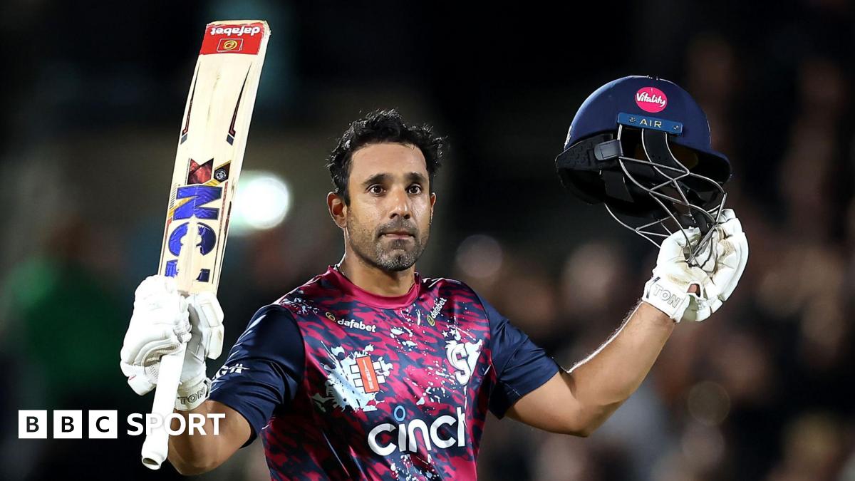 Ravi Bopara with his bat aloft in his right hand and his helmet in his left after scoring a century for Northants against Surrey at The Oval