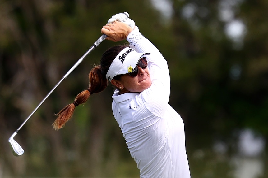 Australia's Hannah Green follows through after hitting an iron shot to the green