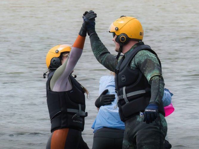 Volunteers celebrate the successful rescue.