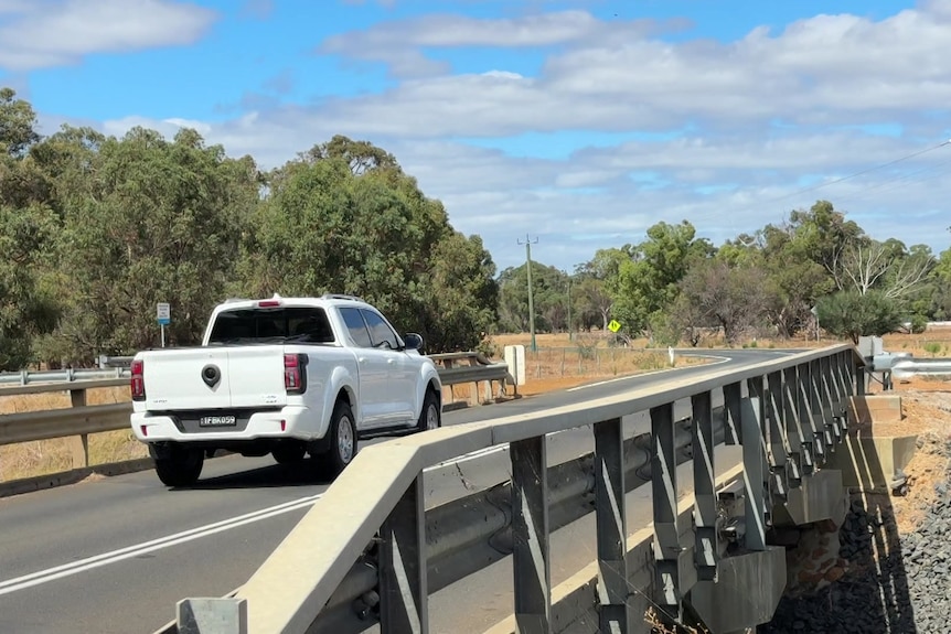 A white ute drives across one of the bridges subject to the new weight limits.