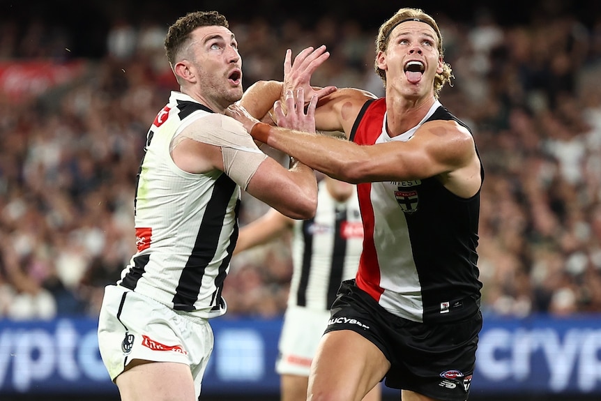 Daniel McStay of the Magpies and Tom De Koning of the Saints compete in a ruck contest during a 2026 AFL match.