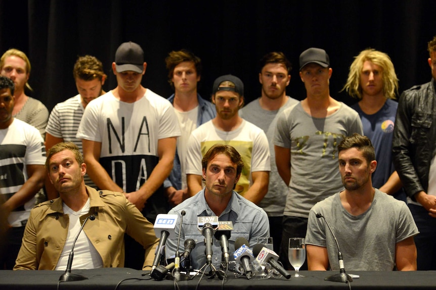 The Essendon team at a press conference