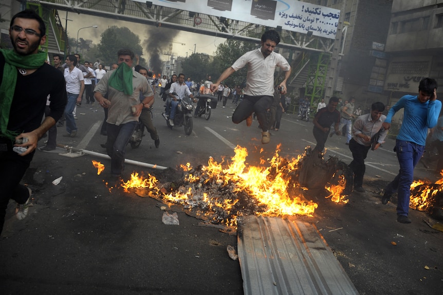 Protesters with a fire on the streets of Iran in 2009.