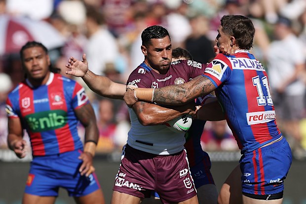 Jamal Fogarty is tackled.