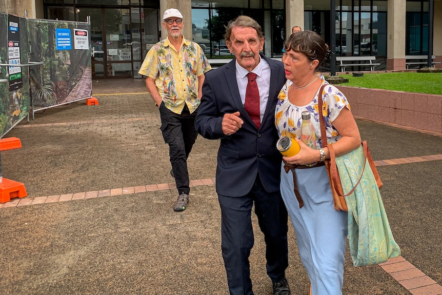 people leaving a courthouse