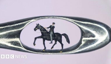 A zoomed-in picture of a micro model of Tommy Shelby riding a horse inside a needle's eye