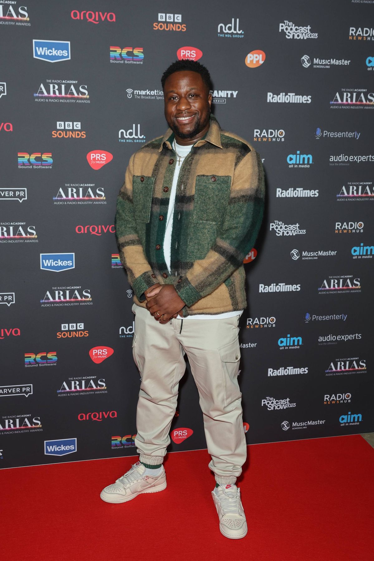 Actor, comedian and Im a Celeb contestant Babatunde Aleshe showed up on the red carpet looking cool and casual in some cream cargo pants, a checked jacket and some Nike trainers.