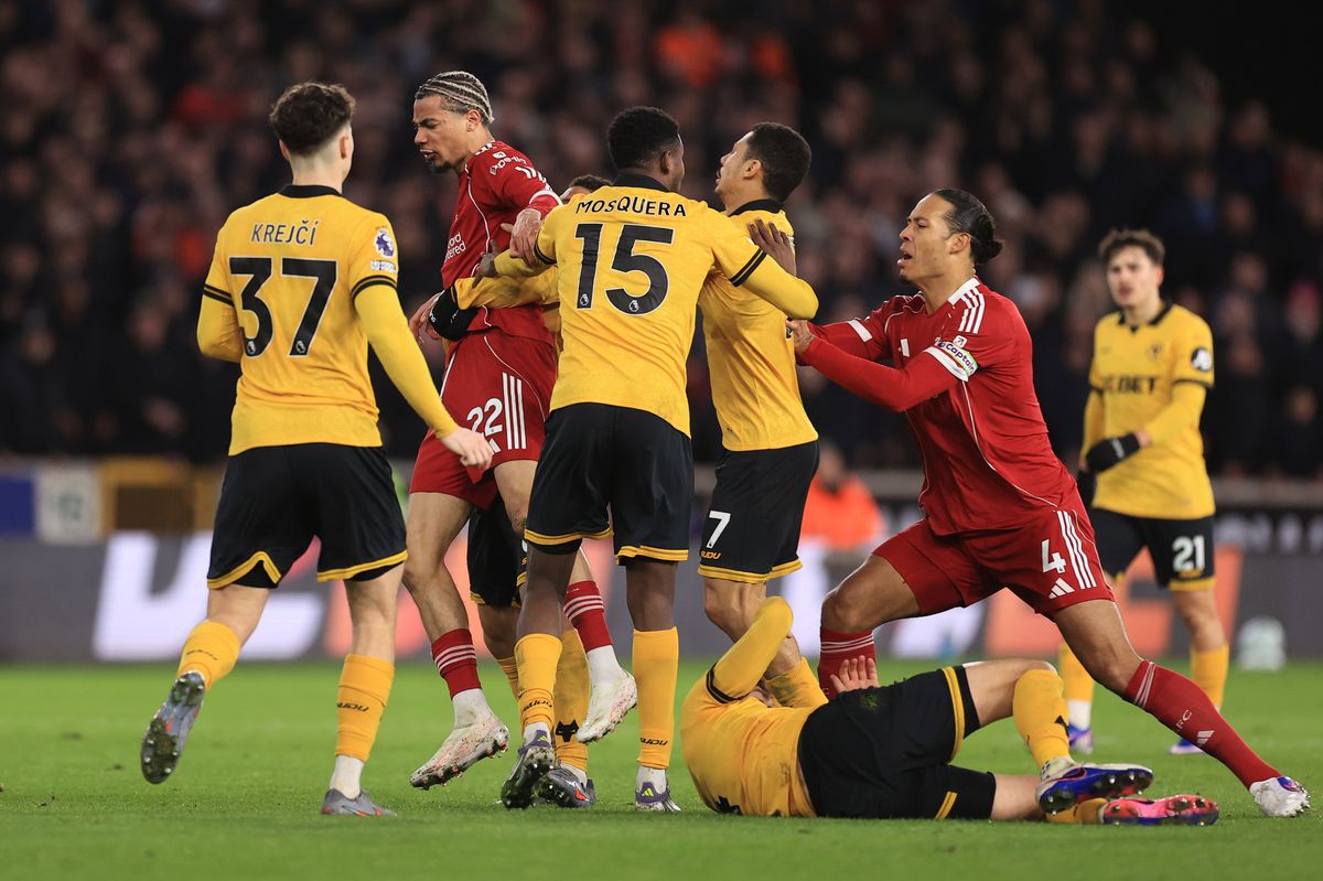 Hugo Ekitike and Virgil van Dijk clash with Wolves players during Liverpool's defeat at Molineux
