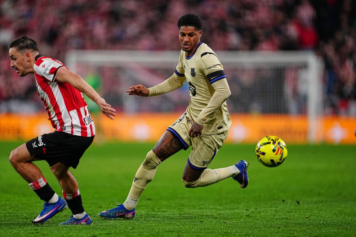 Barcelona's Marcus Rashford, right, and Athletic Bilbao's Aymeric Laporte go for the ball during the Spanish La Liga soccer match between Athletic Bilbao and Barcelona in Bilbao