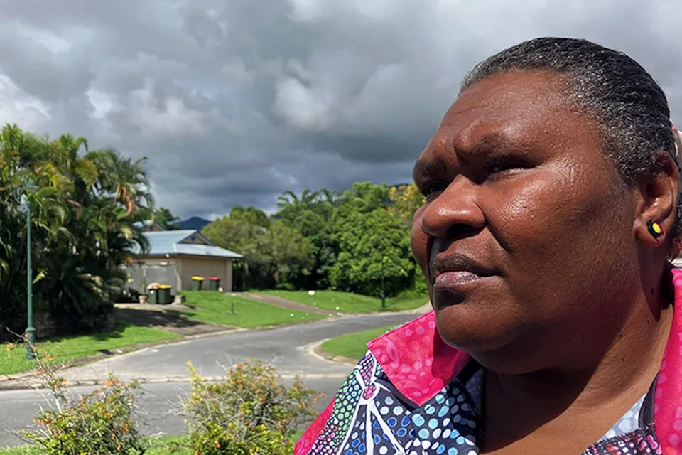 Leichan Williams standing in front of her garden. 