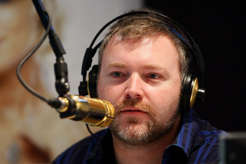 Kyle Sandilands speaks behind the microphone