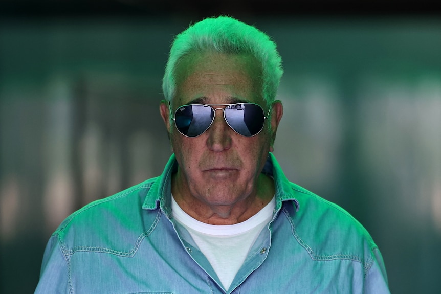 Aston Martin team owner Lawrence Stroll walking through the garage