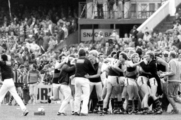 Jubilant Essendon players and officials share that special one-day-in-September feeling after triumphing over Hawthorn in 1984.