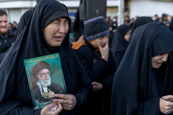 Women weep as thousands of people gather in Enghelab Square for a pro-government demonstration after Iranian state media confirmed the death of Ayatollah Ali Khamenei