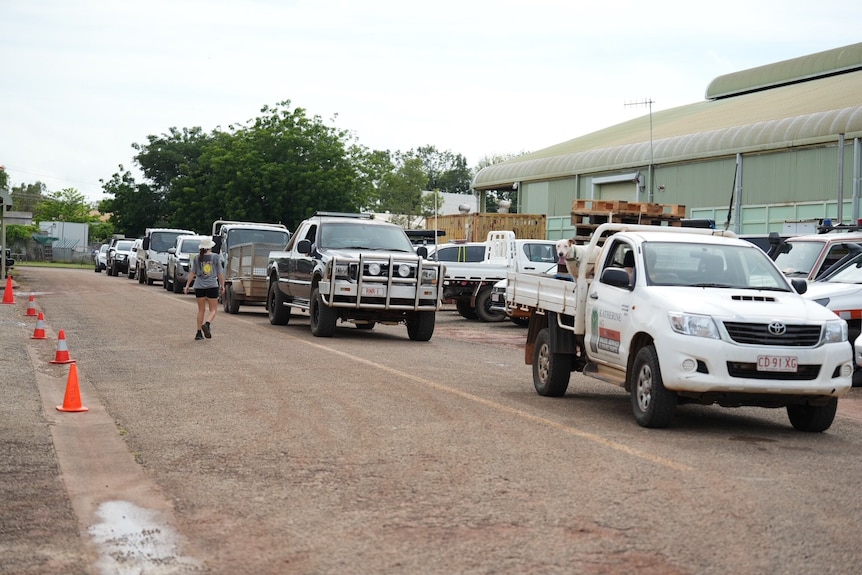 Cars lining up for sandbags.