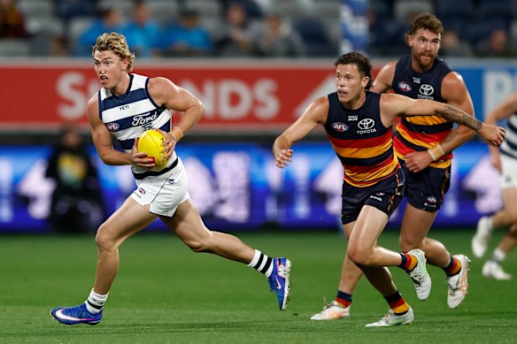Tanner Bruhn bursts clear with ball-in-hand against the Crows. 