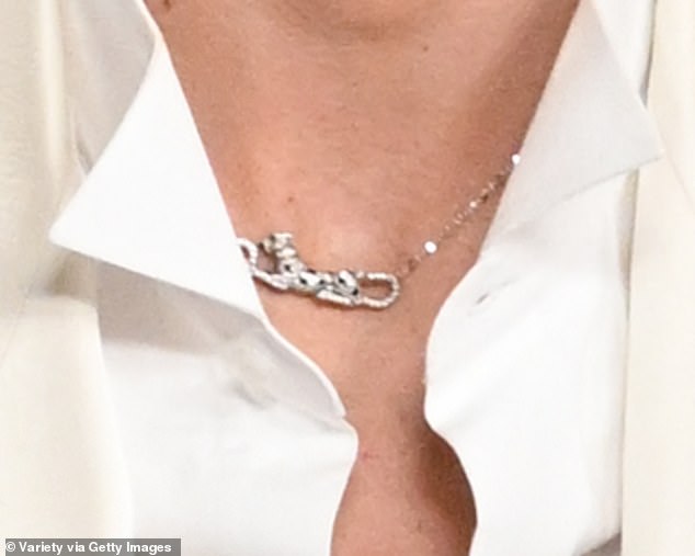 Chalamet styled his white blazer and black slacks with a Panthère de Cartier necklace