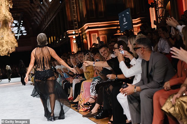 Beachley said: 'The crowd cheered, the energy was electric, and my favourite compliment of the night? ¿I have never ever seen someone bring so much joy to the runway!¿'